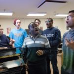 A piano-side rehearsal for one of Williams' many singing groups.