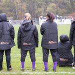Players on Williams' women's soccer team cheer on their teammates from the sidelines.