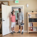 Two roommates, one a videographer and one a photographer, in the Matt Cole Library in the Center for Environmental Studies, housed in the Class of 1966 Environmental Center, a Living Building.