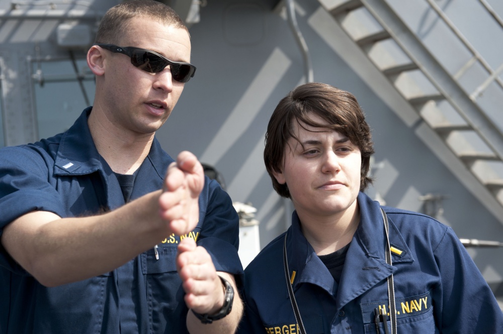 Steph Berger, Williams Class of 2011, at right, aboard the USS Pearl Harbor.