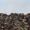Photograph showing a hill of trash from a dump.