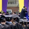 President Maud S. Mandel hugs a graduate during commencement.