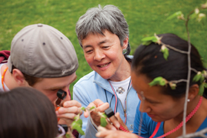 Williams biology professor Joan Edwards examines plants with her students.