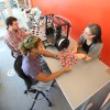 A Williams professor works with two students in a new Center for Educational Technology space.