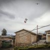 Photo of a Zipline International drone delivering blood to a village in Rwanda.