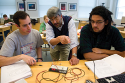Williams physics professor Protik "Tiku" Majumder with students in his lab.