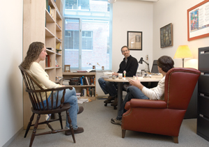 Williams English professor Peter Murphy in his office with students.