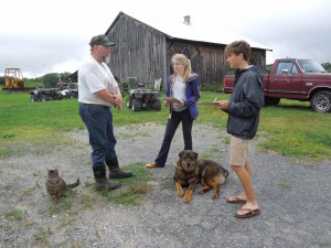 From left: farmer Neil Oleson is interviewed by students Samantha Murray, Class of 2014, and David Nolan, Class of 2013, for the Keep Berkshire Farming project.