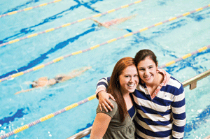Swimmers Logan Todhunter ’12 (left) and Caroline Wilson