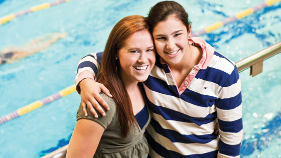 Swimmers Logan Todhunter, class of 2012, to the left, and Caroline Wilson, class of 2013, on the right. Photo by Mark McCarty