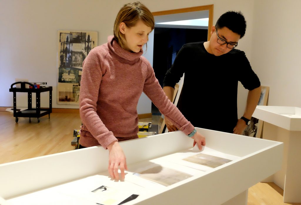 Curator Lisa Dorin and Alex Jen ’19 look at materials from the course Rauschenberg: Art & Archives, which informed an exhibition that runs through Aug. 20, 2017.