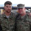 A photo shows alumnus Hank Montalbano with his arm around a colleague from the military.